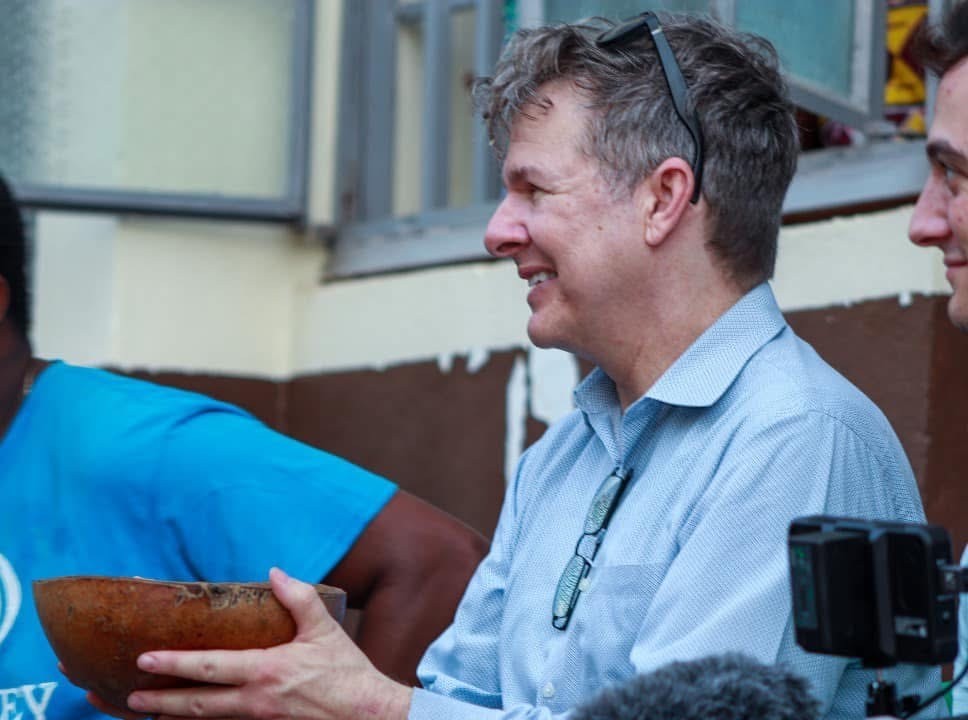 Man in blue shirt smiling