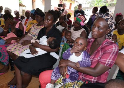 A group of mothers holding their babies